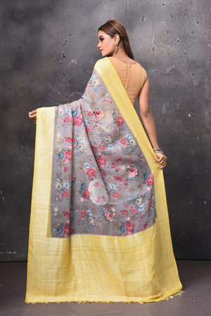 Buy beautiful light grey floral chiffon saree online in USA with yellow zari border. Keep your ethnic wardrobe up to date with latest designer sarees, pure silk sarees, handwoven sarees, tussar silk sarees, embroidered sarees, chiffon saris from Pure Elegance Indian saree store in USA.-back