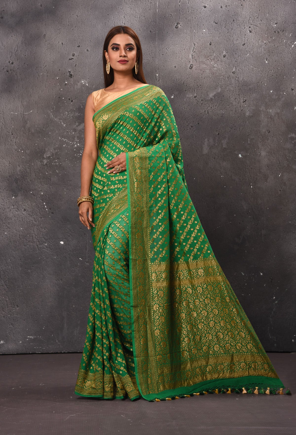 Buy stunning green georgette saree online in USA with overall zari work. Keep your ethnic wardrobe up to date with latest designer sarees, pure silk sarees, handwoven sarees, tussar silk sarees, embroidered sarees, chiffon saris from Pure Elegance Indian saree store in USA.-full view