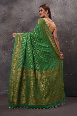 Buy stunning green georgette saree online in USA with overall zari work. Keep your ethnic wardrobe up to date with latest designer sarees, pure silk sarees, handwoven sarees, tussar silk sarees, embroidered sarees, chiffon saris from Pure Elegance Indian saree store in USA.-back