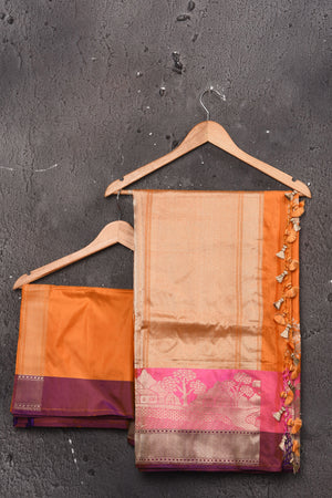Buy beautiful orange Katan silk saree online in USA with pink zari border and pallu. Keep your ethnic wardrobe up to date with latest designer sarees, pure silk sarees, handwoven sarees, tussar silk sarees, embroidered sarees, chiffon saris from Pure Elegance Indian saree store in USA.-blouse