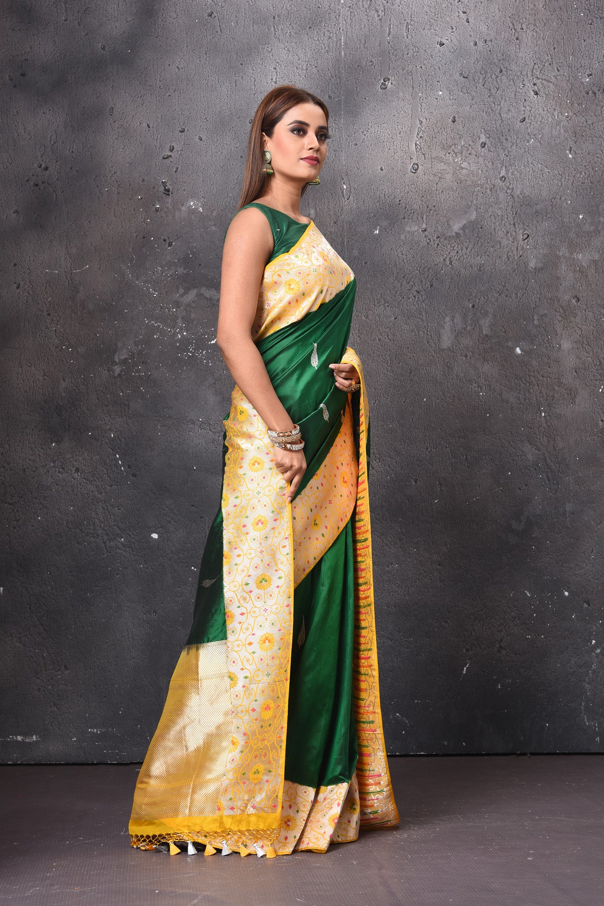 Buy beautiful dark green Katan silk sari online in USA with zari minakari yellow border. Keep your ethnic wardrobe up to date with latest designer sarees, pure silk sarees, handwoven sarees, tussar silk sarees, embroidered saris, chiffon saris from Pure Elegance Indian saree store in USA.-side