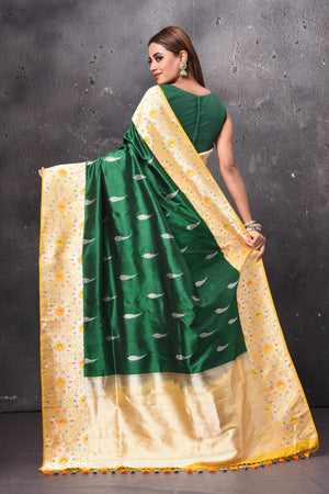 Buy beautiful dark green Katan silk sari online in USA with zari minakari yellow border. Keep your ethnic wardrobe up to date with latest designer sarees, pure silk sarees, handwoven sarees, tussar silk sarees, embroidered saris, chiffon saris from Pure Elegance Indian saree store in USA.-back