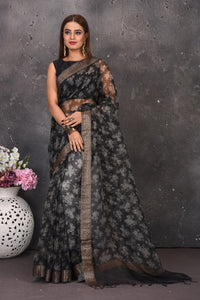 Buy stunning black and white printed saree online in USA with zari border. Keep your ethnic wardrobe up to date with latest designer sarees, pure silk sarees, handwoven sarees, tussar silk sares, embroidered sarees from Pure Elegance Indian saree store in USA.-full view