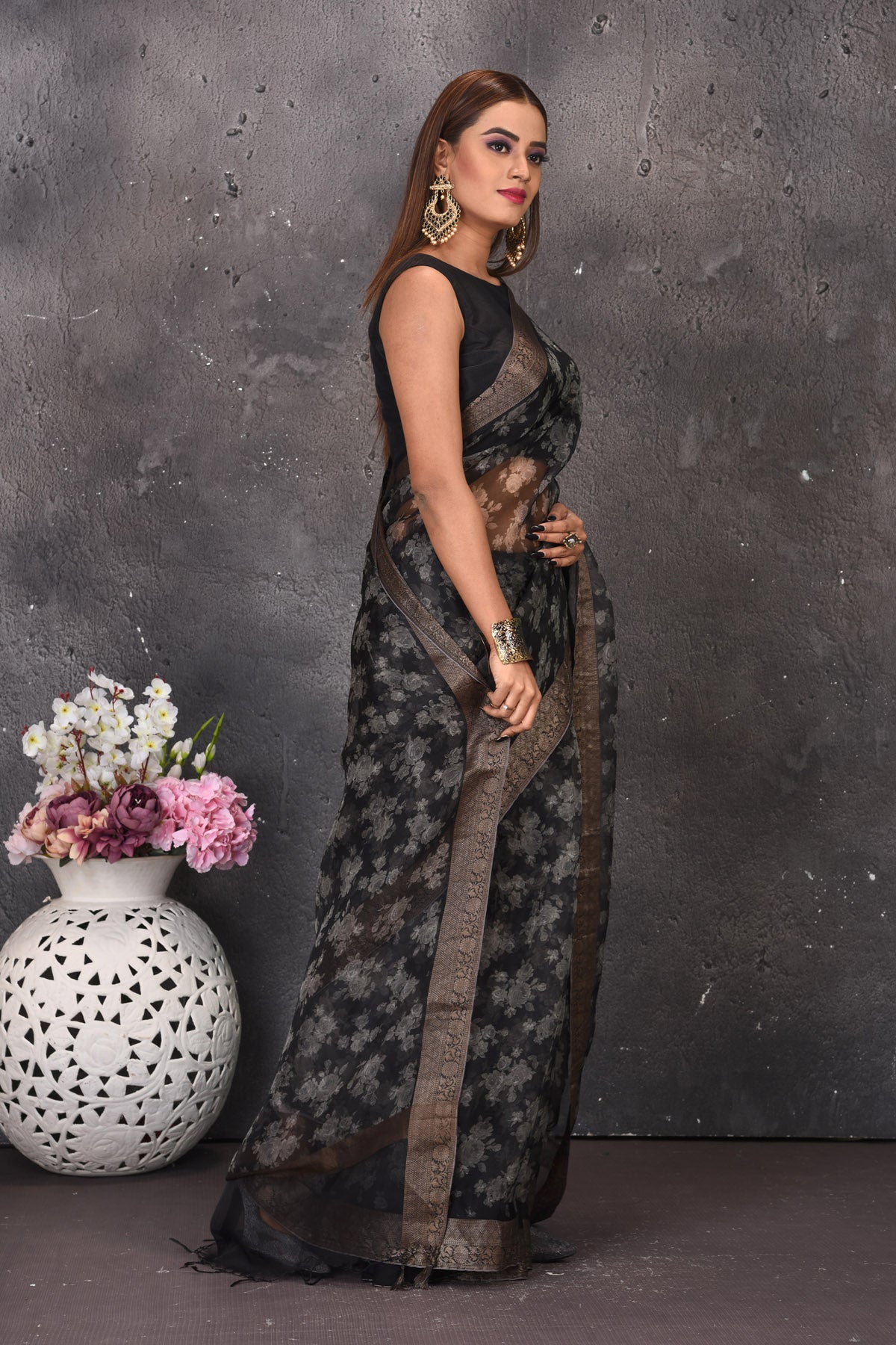 Buy stunning black and white printed saree online in USA with zari border. Keep your ethnic wardrobe up to date with latest designer sarees, pure silk sarees, handwoven sarees, tussar silk sares, embroidered sarees from Pure Elegance Indian saree store in USA.-side
