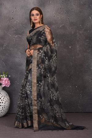 Buy stunning black and white printed sari online in USA with zari border. Keep your ethnic wardrobe up to date with latest designer sarees, pure silk sarees, handwoven sarees, tussar silk sares, embroidered sarees from Pure Elegance Indian saree store in USA.-side