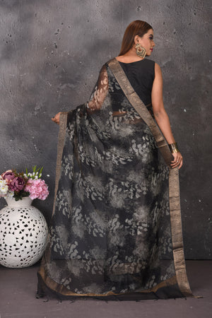 Buy stunning black and white printed sari online in USA with zari border. Keep your ethnic wardrobe up to date with latest designer sarees, pure silk sarees, handwoven sarees, tussar silk sares, embroidered sarees from Pure Elegance Indian saree store in USA.-back