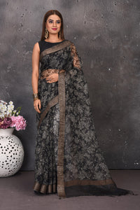 Buy stunning black and white printed floral sari online in USA with zari border. Keep your ethnic wardrobe up to date with latest designer sarees, pure silk sarees, handwoven sarees, tussar silk sares, embroidered sarees from Pure Elegance Indian saree store in USA.-full view