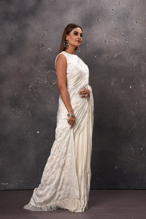 Buy beautiful white Mashru silk saree online in USA with feather pallu and blouse. Enrich your ethnic wardrobe with traditional Indian sarees, designer sarees. embroidered sarees, pure silk sarees, handwoven sarees, Kanchipuram sarees, Banarasi saris from Pure Elegance Indian saree store in USA.-side