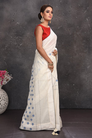 Shop stunning off-white polka dot applique linen saree online in USA. Keep your ethnic wardrobe up to date with latest designer sarees, pure silk sarees, handwoven sarees, tussar silk sarees, embroidered sarees from Pure Elegance Indian saree store in USA.-side
