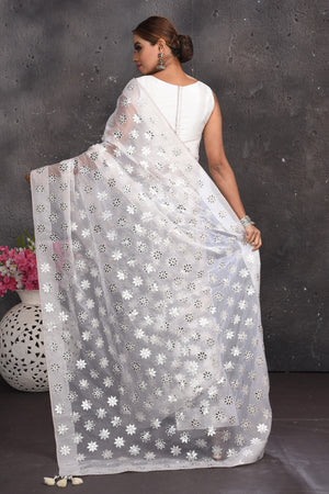 Buy beautiful white organza saree online in USA with silver applique work. Keep your ethnic wardrobe up to date with latest designer sarees, pure silk sarees, handwoven sarees, tussar silk sarees, embroidered sarees from Pure Elegance Indian saree store in USA.-back