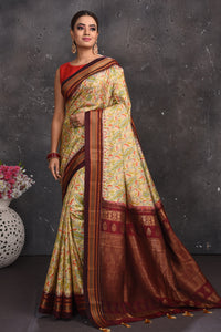 Shop stunning light yellow floral silk sari online in USA with zari border. Keep your ethnic wardrobe up to date with latest designer sarees, pure silk sarees, handwoven sarees, tussar silk sarees, embroidered sarees from Pure Elegance Indian saree store in USA.-full view