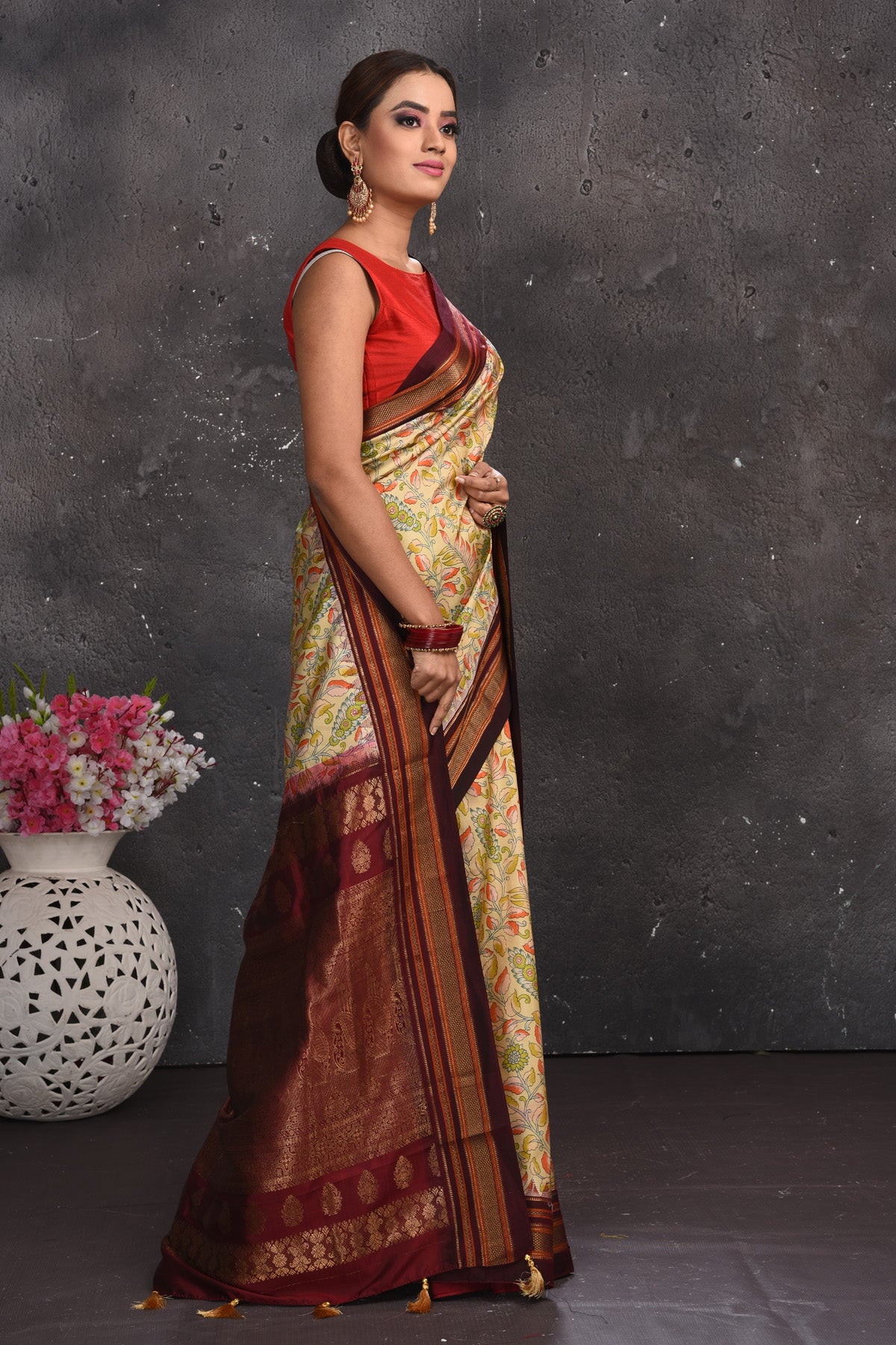Shop stunning light yellow floral silk sari online in USA with zari border. Keep your ethnic wardrobe up to date with latest designer sarees, pure silk sarees, handwoven sarees, tussar silk sarees, embroidered sarees from Pure Elegance Indian saree store in USA.-side