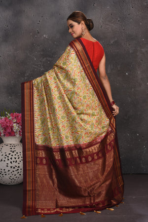 Shop stunning light yellow floral silk sari online in USA with zari border. Keep your ethnic wardrobe up to date with latest designer sarees, pure silk sarees, handwoven sarees, tussar silk sarees, embroidered sarees from Pure Elegance Indian saree store in USA.-back