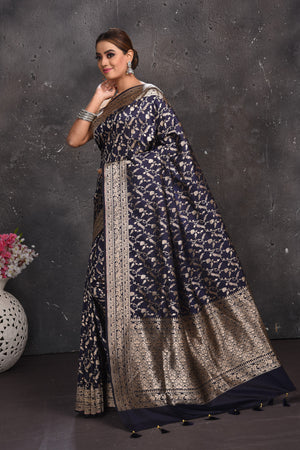 Buy beautiful navy blue heavy Banarasi silk sari online in USA with silver zari work. Keep your ethnic wardrobe up to date with latest designer sarees, pure silk sarees, Kanchipuram silk sarees, handwoven sarees, tussar silk sarees, embroidered sarees from Pure Elegance Indian saree store in USA.-pallu