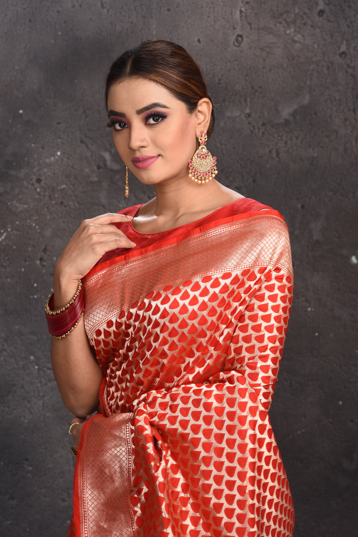 Shop stunning red Banarasi silk saree online in USA with zari border. Keep your ethnic wardrobe up to date with latest designer sarees, pure silk sarees, handwoven sarees, tussar silk sarees, embroidered sarees from Pure Elegance Indian saree store in USA.-closeup