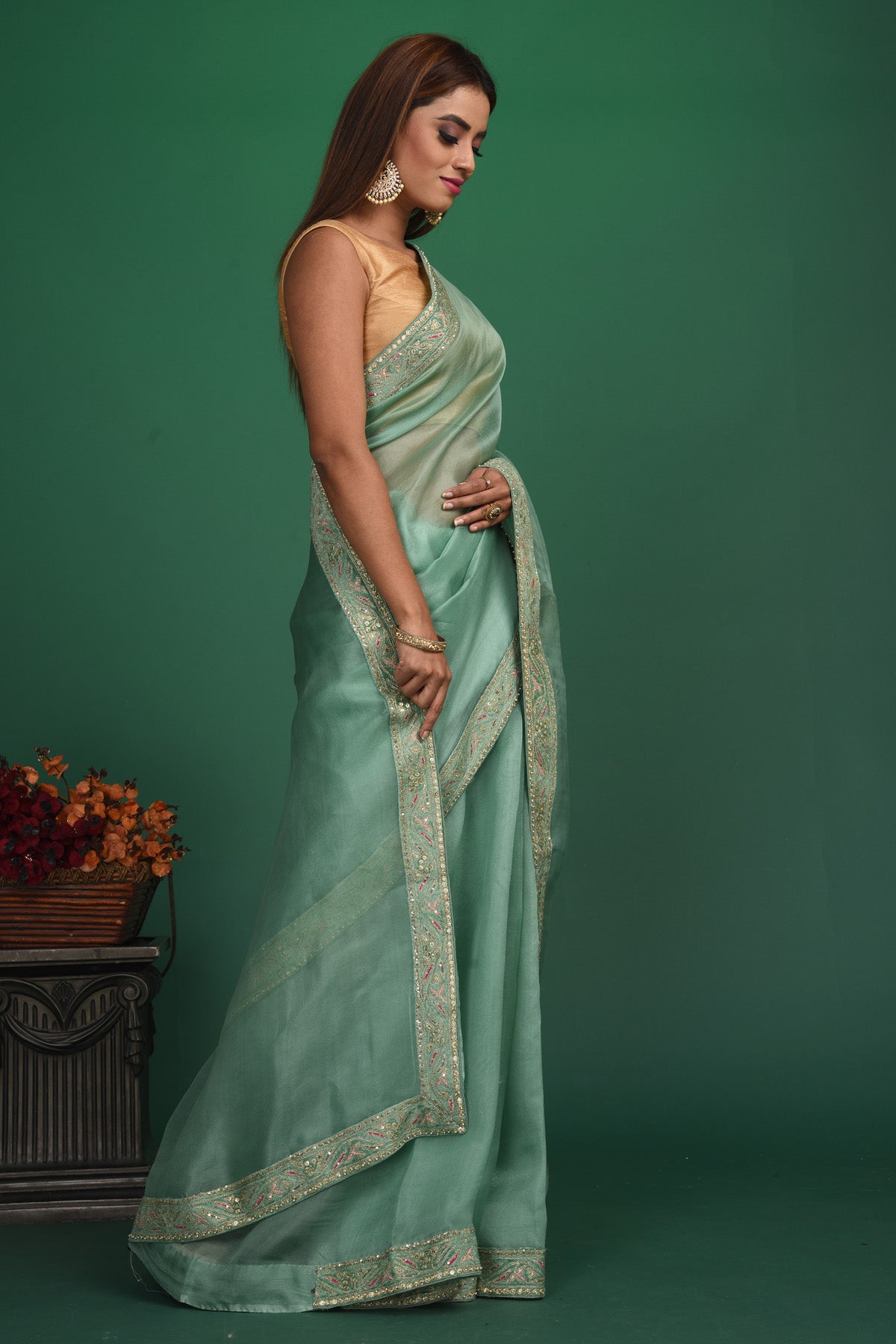 Buy beautiful sage green organza sari online in USA with heavy embroidery blouse. Keep your ethnic wardrobe up to date with latest designer sarees, pure silk sarees, handwoven sarees, tussar silk sarees, embroidered sarees, organza saris from Pure Elegance Indian saree store in USA.-side