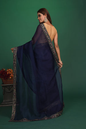 Buy stunning navy blue organza sari online in USA with heavy embroidery blouse. Keep your ethnic wardrobe up to date with latest designer sarees, pure silk sarees, handwoven sarees, tussar silk sarees, embroidered sarees, organza saris from Pure Elegance Indian saree store in USA.-back