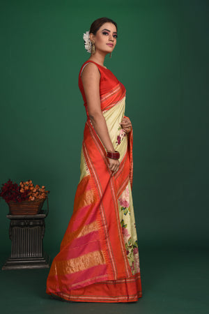 Shop beautiful cream printed Gadhwal sari online in USA with red zari border. Keep your ethnic wardrobe up to date with latest designer sarees, pure silk sarees, handwoven sarees, tussar silk sarees, embroidered sarees, organza saris from Pure Elegance Indian saree store in USA.-side