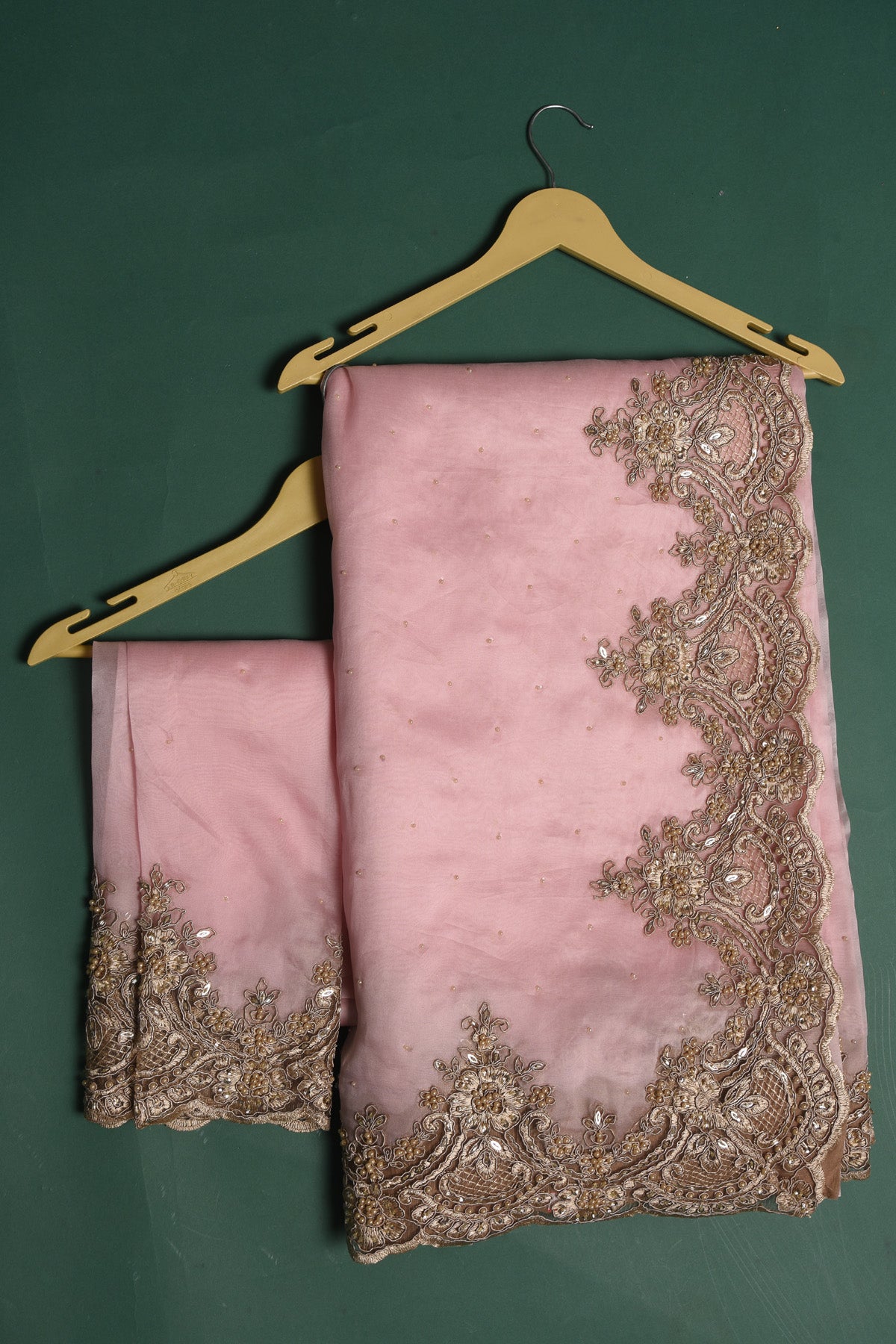Shop beautiful powder pink embroidered organza sari online in USA. Keep your ethnic wardrobe up to date with latest designer sarees, pure silk sarees, handwoven sarees, tussar silk sarees, embroidered sarees, organza saris from Pure Elegance Indian saree store in USA.-blouse
