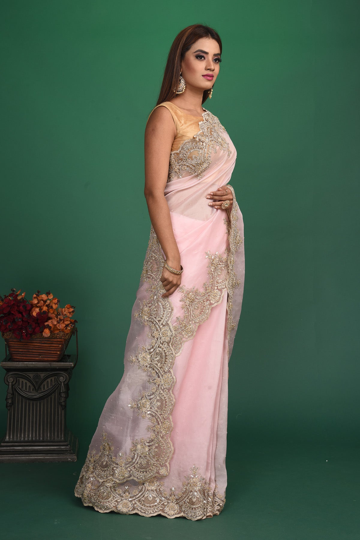 Shop beautiful powder pink embroidered organza sari online in USA. Keep your ethnic wardrobe up to date with latest designer sarees, pure silk sarees, handwoven sarees, tussar silk sarees, embroidered sarees, organza saris from Pure Elegance Indian saree store in USA.-side