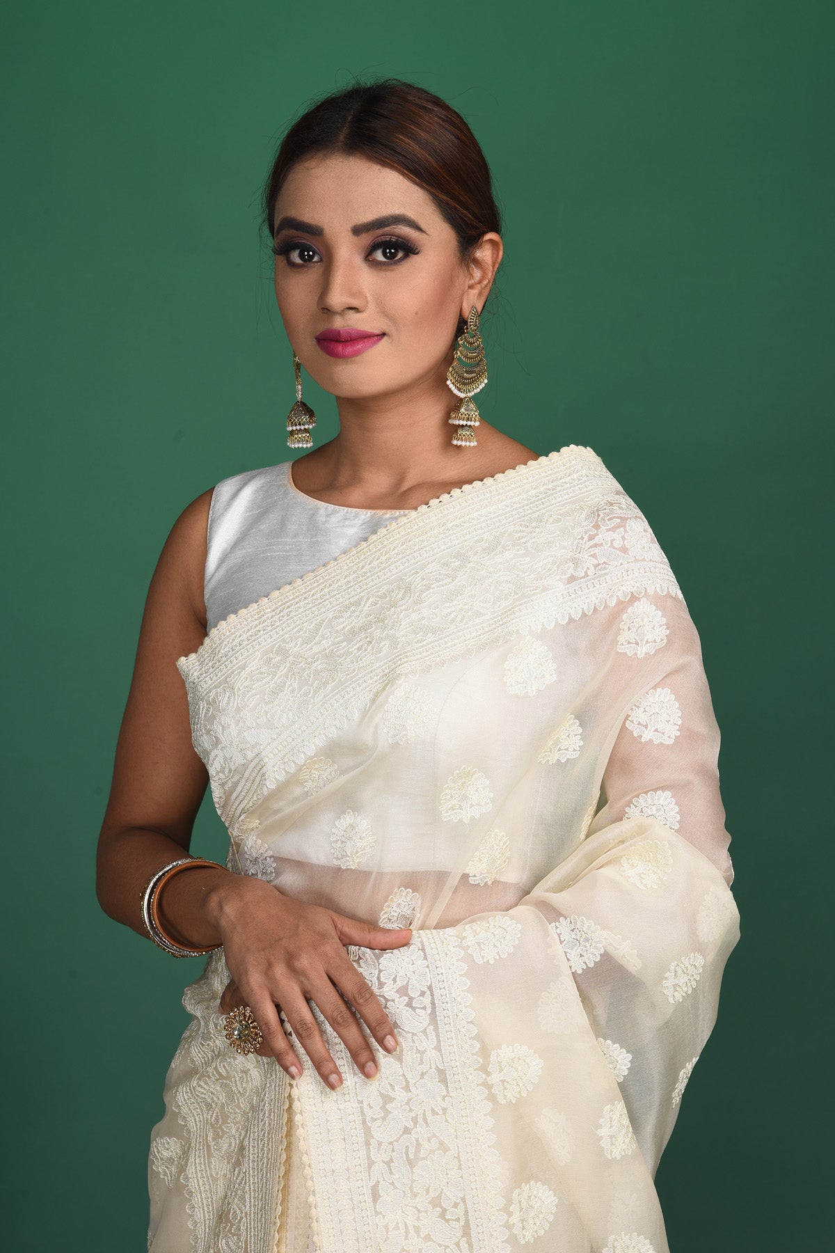 Shop stunning off-white Lucknowi georgette sari online in USA. Keep your ethnic wardrobe up to date with latest designer sarees, pure silk sarees, handwoven sarees, tussar silk sarees, embroidered sarees, organza saris from Pure Elegance Indian saree store in USA.-closeup