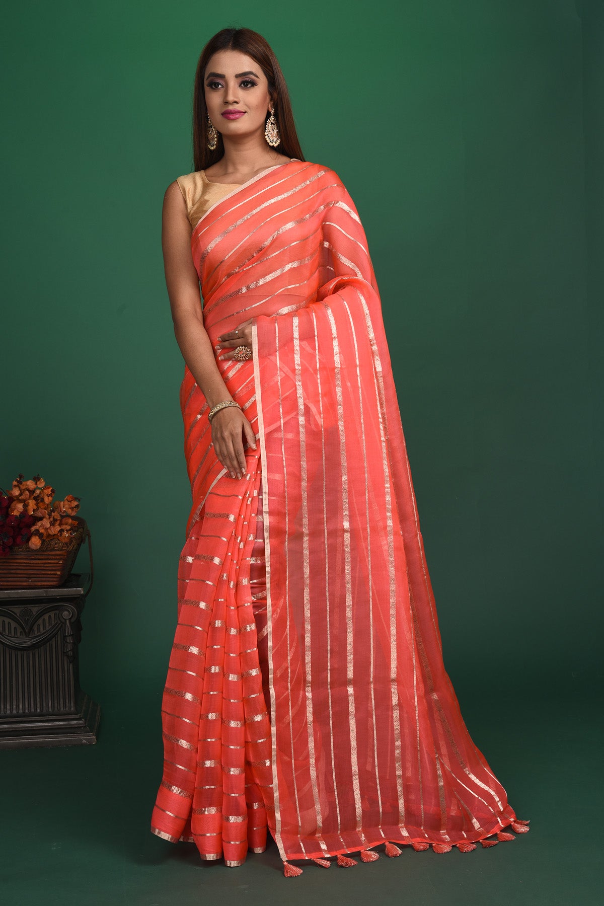 Buy beautiful coral pink organza saree online in USA with multicolor saree blouse. Slay ethnic style on special occasions with beautiful designer sarees, handwoven sarees, embroidered sarees, party wear sarees, Bollywood sarees from Pure Elegance Indian saree store in USA.-full view