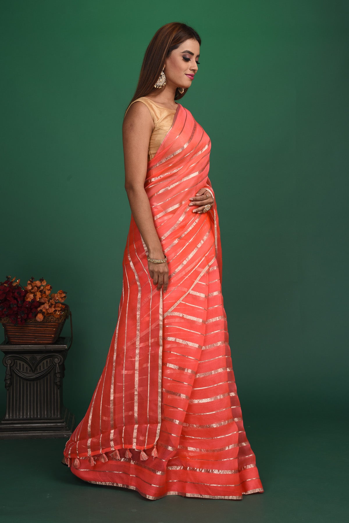 Buy beautiful coral pink organza saree online in USA with multicolor saree blouse. Slay ethnic style on special occasions with beautiful designer sarees, handwoven sarees, embroidered sarees, party wear sarees, Bollywood sarees from Pure Elegance Indian saree store in USA.-side