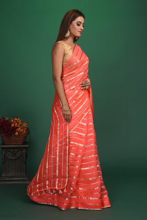 Buy beautiful coral pink organza saree online in USA with multicolor saree blouse. Slay ethnic style on special occasions with beautiful designer sarees, handwoven sarees, embroidered sarees, party wear sarees, Bollywood sarees from Pure Elegance Indian saree store in USA.-side
