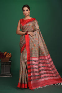 Shop elegant grey vidharba tussar printed saree online in USA with red border. Slay ethnic style on special occasions with beautiful designer sarees, handwoven sarees, embroidered sarees, party wear sarees, Bollywood sarees from Pure Elegance Indian saree store in USA.-full view