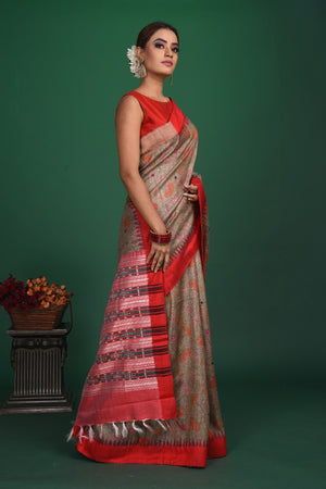 Shop elegant grey vidharba tussar printed saree online in USA with red border. Slay ethnic style on special occasions with beautiful designer sarees, handwoven sarees, embroidered sarees, party wear sarees, Bollywood sarees from Pure Elegance Indian saree store in USA.-side