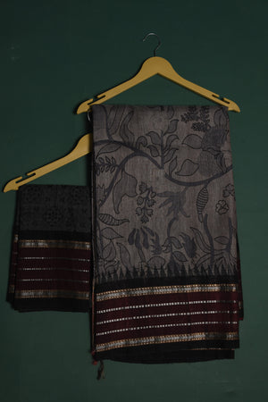 Buy this exquisite dark grey tussar saree with multicolor vidharbha and zari border online in USA which is handcrafted from fine silk tussar fabric, this tie and dye saree brings out the nature of flow. This tussar saree with elegant Vidharbha border is making everyone swoon over it. Make it yours and flaunt a handwoven marvel with minimal jewellery for a casual day outfit. Add this pure tussar saree to your collection from Pure Elegance Indian fashion store in USA.-Unstitched blouse.