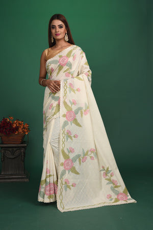 Elegance in simplicity! Our Rigel White Mulmul Saree is an epitome of beauty with its calm and soothing color and sheen texture. This saree is crafted in mulmul cotton that hugs you for effortless and comfortable styling. Style this up with jewelry pieces from our Dhatu collection for a simple and stylish look. Shop this designer saree from Pure Elegance Indian Fashion Store Online in USA.-Full view with open pallu.