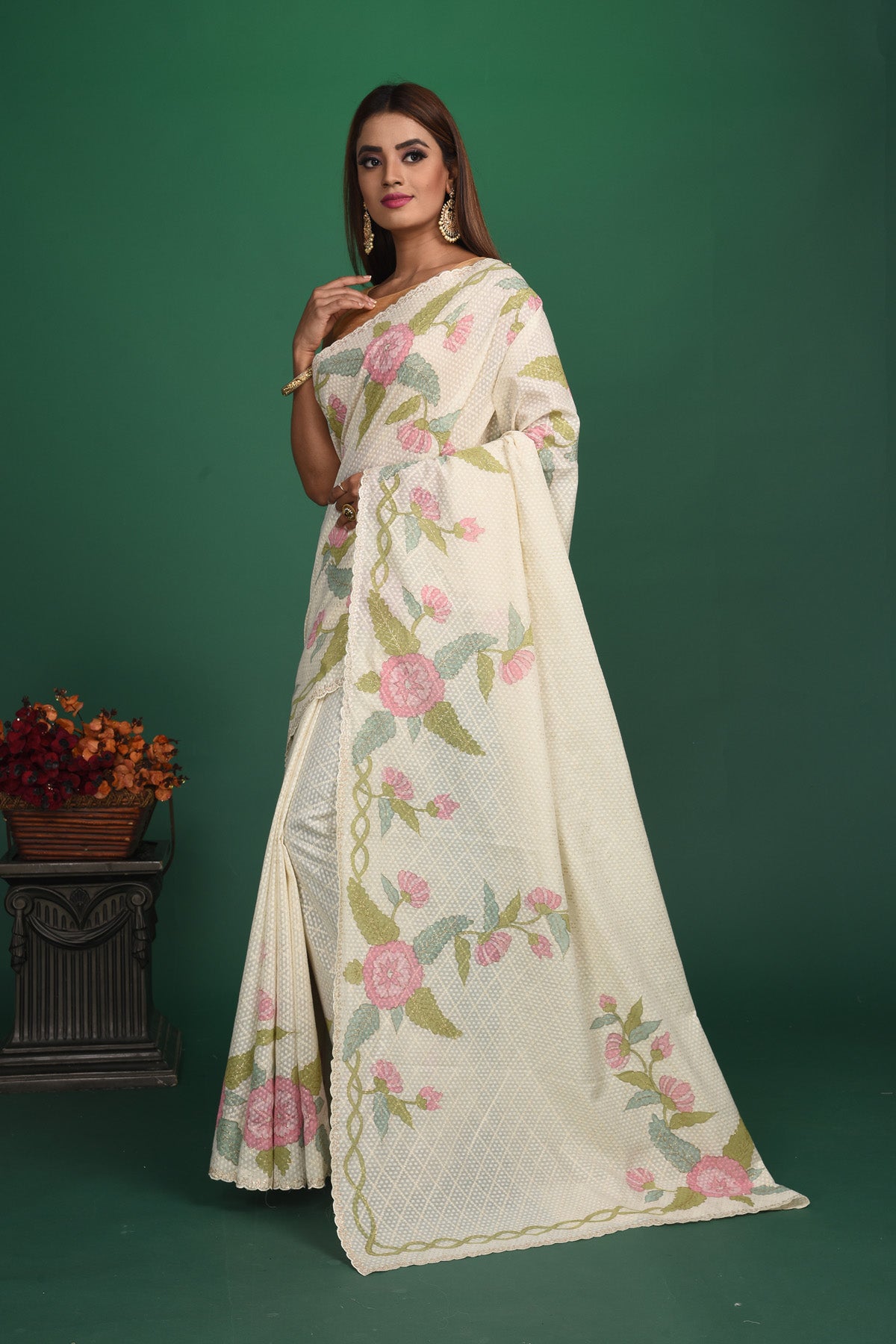 Elegance in simplicity! Our Rigel White Mulmul Saree is an epitome of beauty with its calm and soothing color and sheen texture. This saree is crafted in mulmul cotton that hugs you for effortless and comfortable styling. Style this up with jewelry pieces from our Dhatu collection for a simple and stylish look. Shop this designer saree from Pure Elegance Indian Fashion Store Online in USA.-Side view with open pallu.