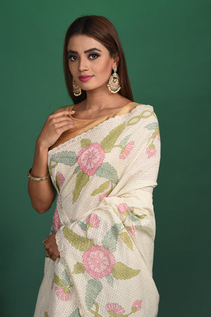 Elegance in simplicity! Our Rigel White Mulmul Saree is an epitome of beauty with its calm and soothing color and sheen texture. This saree is crafted in mulmul cotton that hugs you for effortless and comfortable styling. Style this up with jewelry pieces from our Dhatu collection for a simple and stylish look. Shop this designer saree from Pure Elegance Indian Fashion Store Online in USA.-Close up.