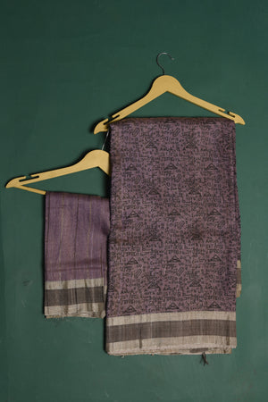 Shop this exquisite lavender purple tussar saree with purple vidharbha border online in USA which is handcrafted from fine silk tussar fabric, this tie and dye saree brings out the nature of flow. This tussar saree with elegant purple Vidharbha border is making everyone swoon over it. Make it yours and flaunt a handwoven marvel with minimal jewellery for a casual day outfit. Add this pure tussar saree to your collection from Pure Elegance Indian fashion store in USA.-Unstitched blouse.