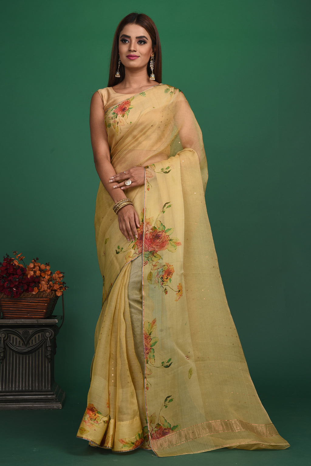Buy this royal handcrafted weaving saree in cotton silk in light yellow color online in USA. It also has a Pallu with bronze weave and fringes. The entire saree has a Golden border and enhance with a beautiful floral pattern.  Make it yours and flaunt a handwoven marvel with minimal jewellery for a casual day outfit. Add this coton silk saree to your collection from Pure Elegance Indian fashion store in USA.-Full view with open pallu.