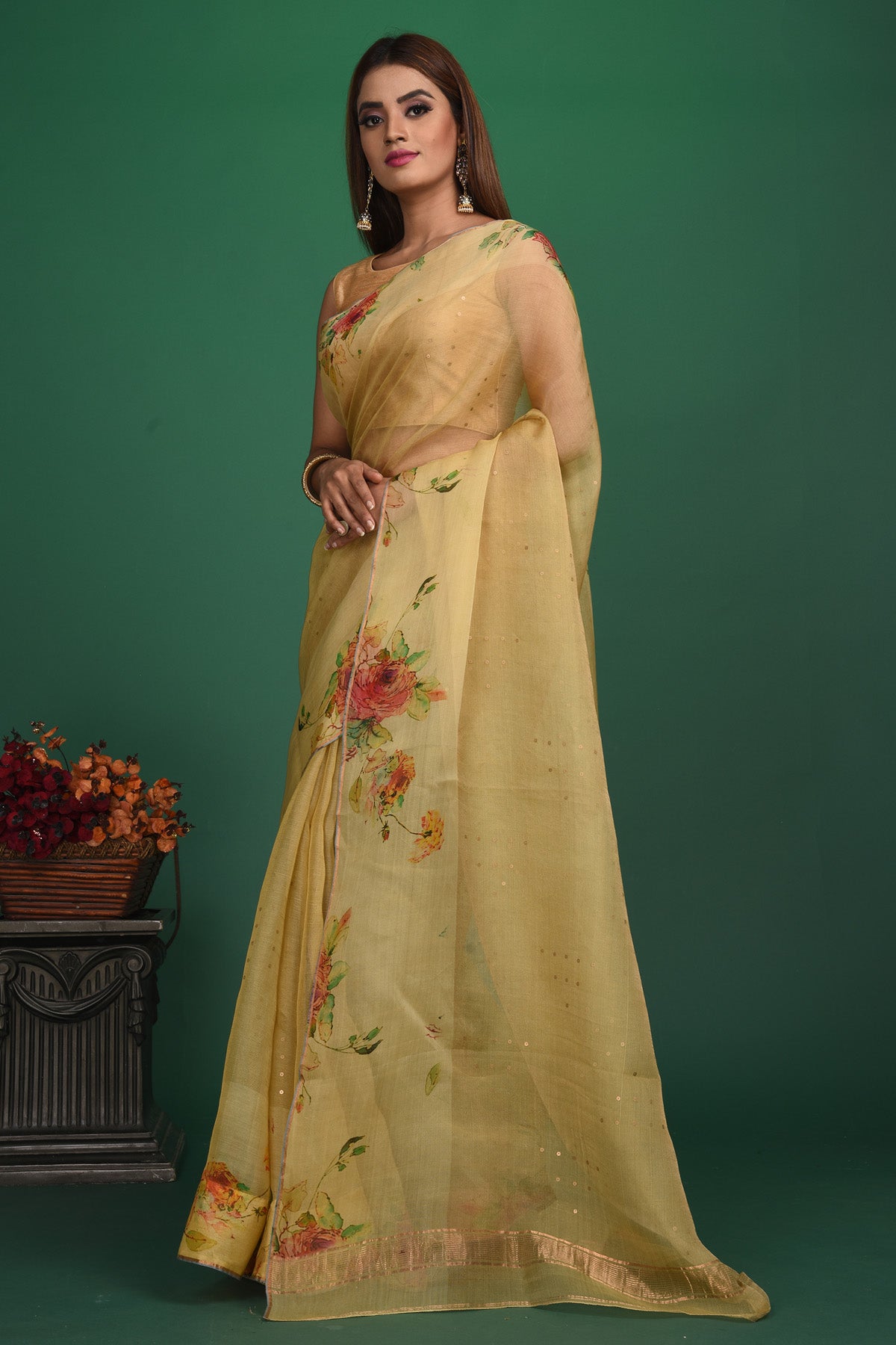Buy this royal handcrafted weaving saree in cotton silk in light yellow color online in USA. It also has a Pallu with bronze weave and fringes. The entire saree has a Golden border and enhance with a beautiful floral pattern.  Make it yours and flaunt a handwoven marvel with minimal jewellery for a casual day outfit. Add this coton silk saree to your collection from Pure Elegance Indian fashion store in USA.-Side view with open pallu.