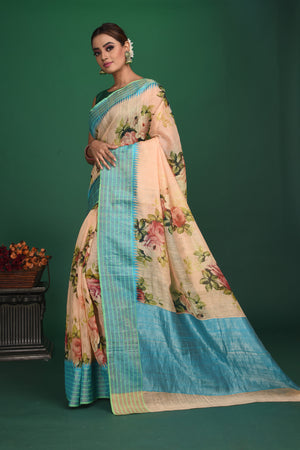 Shop this elegant peach-blue tussars silk saree with floral printed online in USA. This tussar handwoven silk saree will make you look stunningly beautiful. Embellished with a royal pallu and a unstitched blouse. Make it yours and flaunt a handwoven marvel. Add this designer saree from Pure Elegance Indian fashion store in USA.-Side view with open pallu.