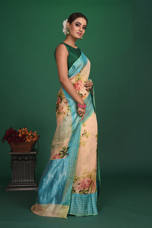 Shop this elegant peach-blue tussars silk saree with floral printed online in USA. This tussar handwoven silk saree will make you look stunningly beautiful. Embellished with a royal pallu and a unstitched blouse. Make it yours and flaunt a handwoven marvel. Add this designer saree from Pure Elegance Indian fashion store in USA.-Side view.