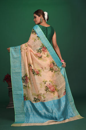 Shop this elegant peach-blue tussars silk saree with floral printed online in USA. This tussar handwoven silk saree will make you look stunningly beautiful. Embellished with a royal pallu and a unstitched blouse. Make it yours and flaunt a handwoven marvel. Add this designer saree from Pure Elegance Indian fashion store in USA.-Back view with open pallu.