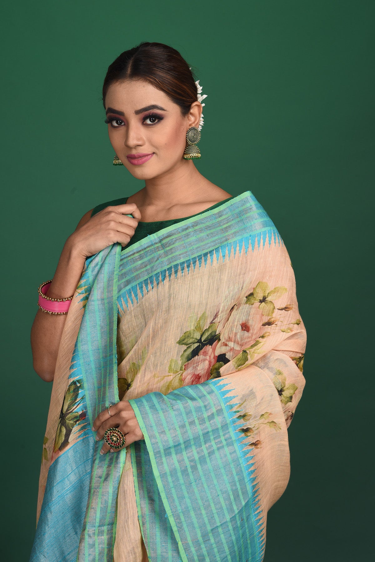 Shop this elegant peach-blue tussars silk saree with floral printed online in USA. This tussar handwoven silk saree will make you look stunningly beautiful. Embellished with a royal pallu and a unstitched blouse. Make it yours and flaunt a handwoven marvel. Add this designer saree from Pure Elegance Indian fashion store in USA.-Close up.