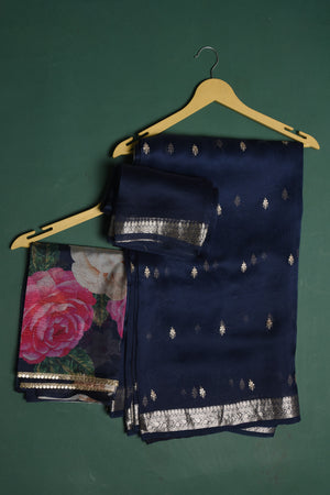 Buy this elegant dark blue soft organza designer saree with silver zari work on heavy border online in USA. Organza silk fabric is a type of silk cloth that is crisp, translucent, and extremely light in weight. It is used to make organza silk saree, drapes, and other decorative pieces. Add this designer sari to your collection from Pure Elegance Indian fashion store in USA.-Unstitched blouse.