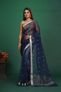 Buy this elegant dark blue soft organza designer saree with silver zari work on heavy border online in USA. Organza silk fabric is a type of silk cloth that is crisp, translucent, and extremely light in weight. It is used to make organza silk saree, drapes, and other decorative pieces. Add this designer sari to your collection from Pure Elegance Indian fashion store in USA.-Full view.