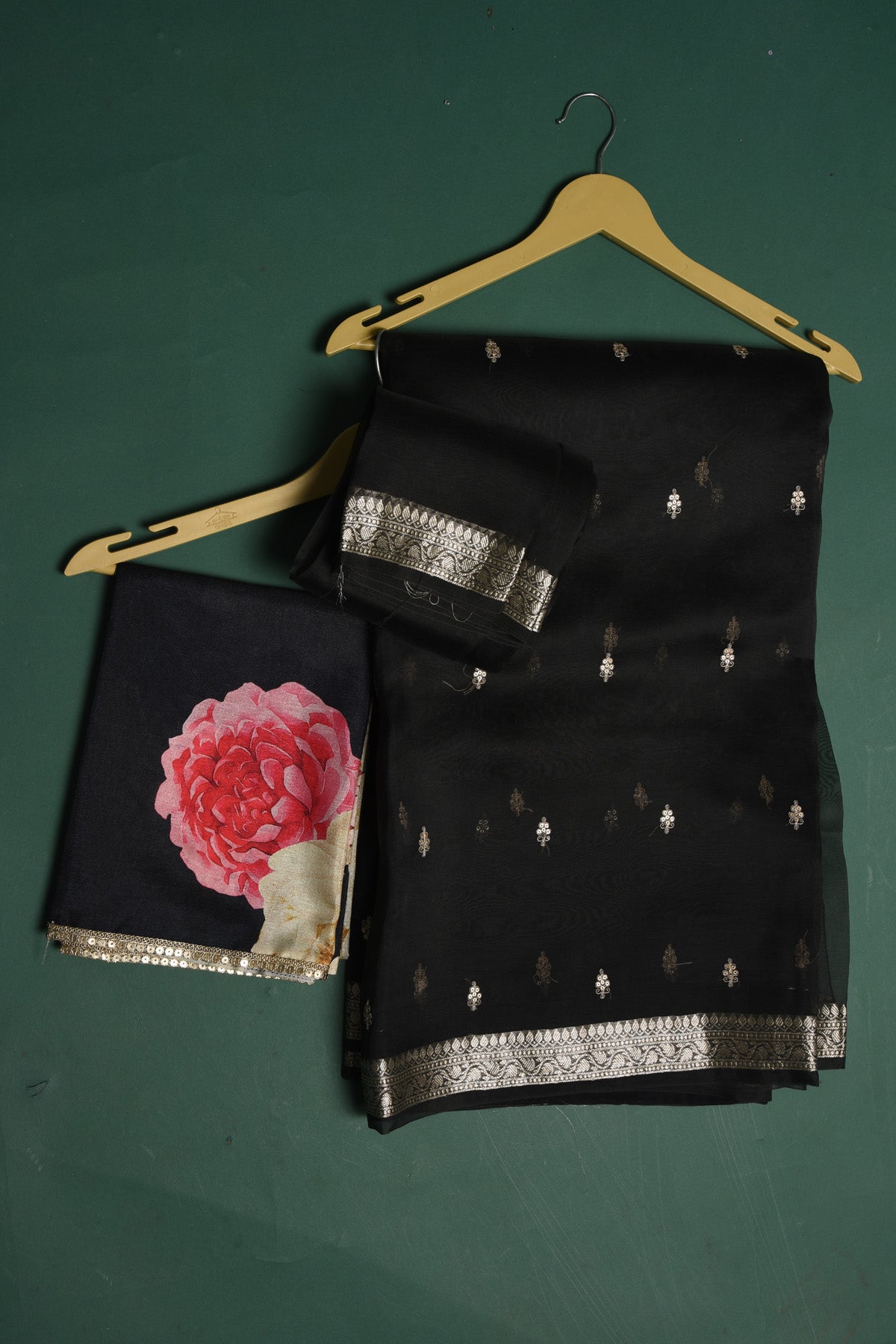 Buy this elegant black soft organza designer saree with silver zari work on heavy border online in USA. Organza silk fabric is a type of silk cloth that is crisp, translucent, and extremely light in weight. It is used to make organza silk saree, drapes, and other decorative pieces. Add this designer sari to your collection from Pure Elegance Indian fashion store in USA.-Unstitched blouse.