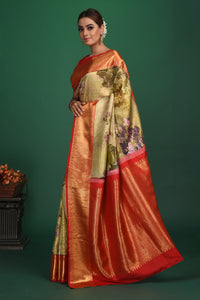 Buy this exquisite pista green Silk handloom Banarasi Saree with red-gold Zari Brocade all over online in USA which has delicate Gold zari Meenakari work a gold Zari border and heavy brocade pallu. Wear this banarasi silk designer saree for your special days with a mini potli bag from Pure Elegance Indian fashion store in USA.-Full view with open pallu.