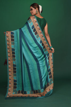 Shop stunning blue striped printed crepe satin saree online in USA. Be a vision of style and elegance at parties and special occasions in beautiful designer sarees, embroidered sarees, printed sarees, satin saris from Pure Elegance Indian fashion store in USA.-back