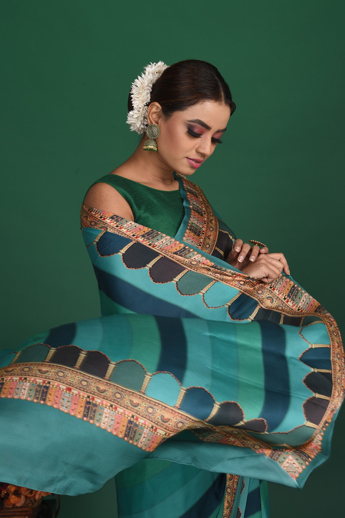 Shop stunning blue striped printed crepe satin saree online in USA. Be a vision of style and elegance at parties and special occasions in beautiful designer sarees, embroidered sarees, printed sarees, satin saris from Pure Elegance Indian fashion store in USA.-closeup