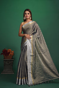 Buy beautiful grey striped tissue Benarasi saree online in USA with zari border. Be a vision of style and elegance at parties and special occasions in beautiful designer sarees, embroidered sarees, printed sarees, satin saris from Pure Elegance Indian fashion store in USA.-full view