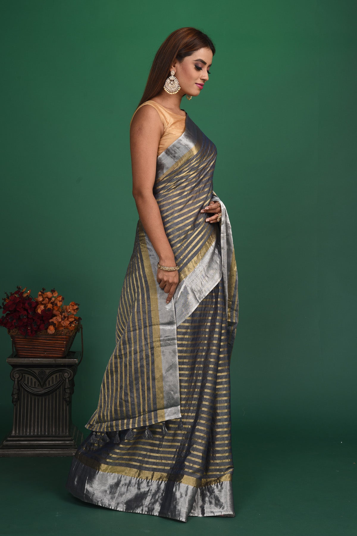 Buy beautiful grey striped tissue Benarasi saree online in USA with zari border. Be a vision of style and elegance at parties and special occasions in beautiful designer sarees, embroidered sarees, printed sarees, satin saris from Pure Elegance Indian fashion store in USA.-side