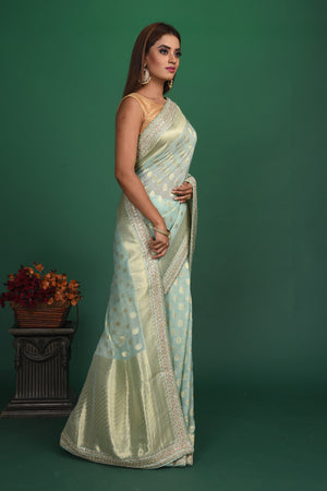 Buy stunning powder blue Benarasi georgette saree online in USA with embroidered border. Be a vision of style and elegance at parties and special occasions in beautiful designer sarees, embroidered sarees, printed sarees, satin saris from Pure Elegance Indian fashion store in USA.-side
